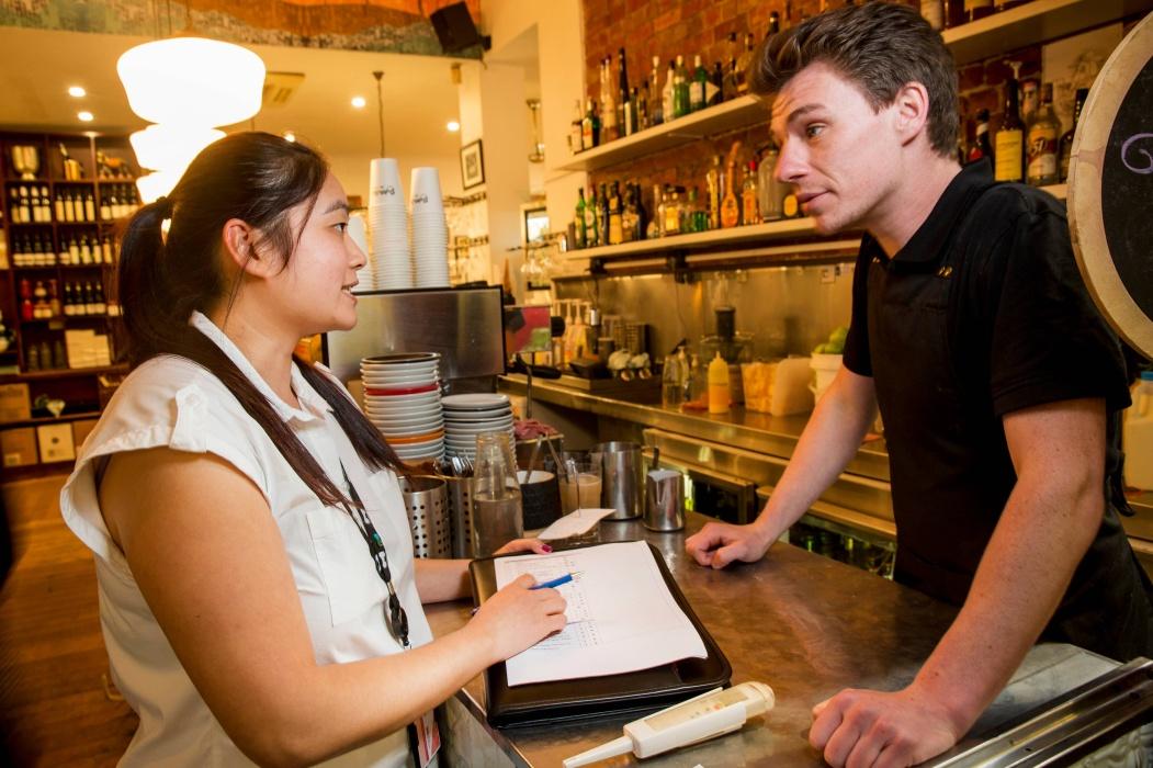 Health inspector auditing bottle shop