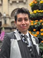 My Melbourne ambassador Pedro Gonzalez, standing in front of Melbourne Town Hall.